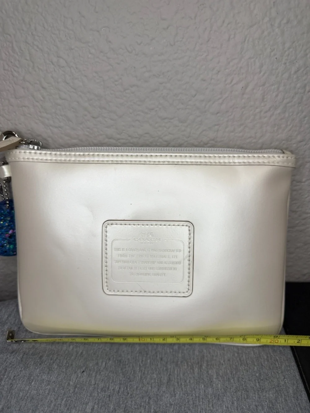 Coach Shimmering Ivory Leather Large Wristlet Clutch with Blue Glitter Charm